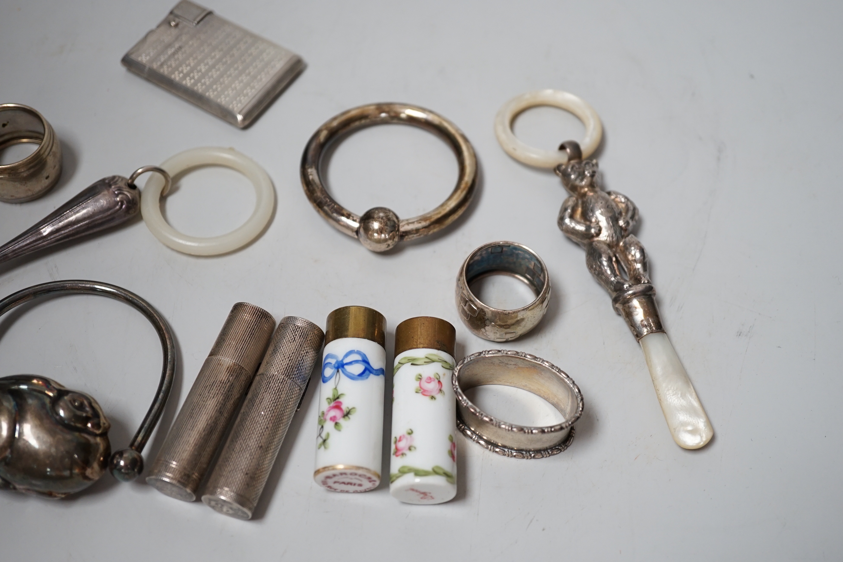 Sundry small silver and other items including teethers, rattles, Asprey & Co silver mounted lighter, etc.